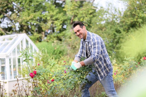 Photograph of a maintenance crew discussing accessible garden layout with a resident