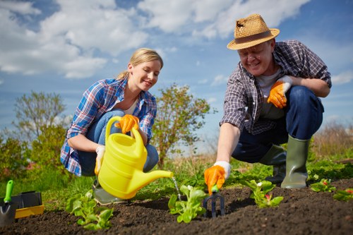 Community volunteers receiving donated plants and tools